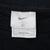Nike neck tag showing size large and Made in Mexico label