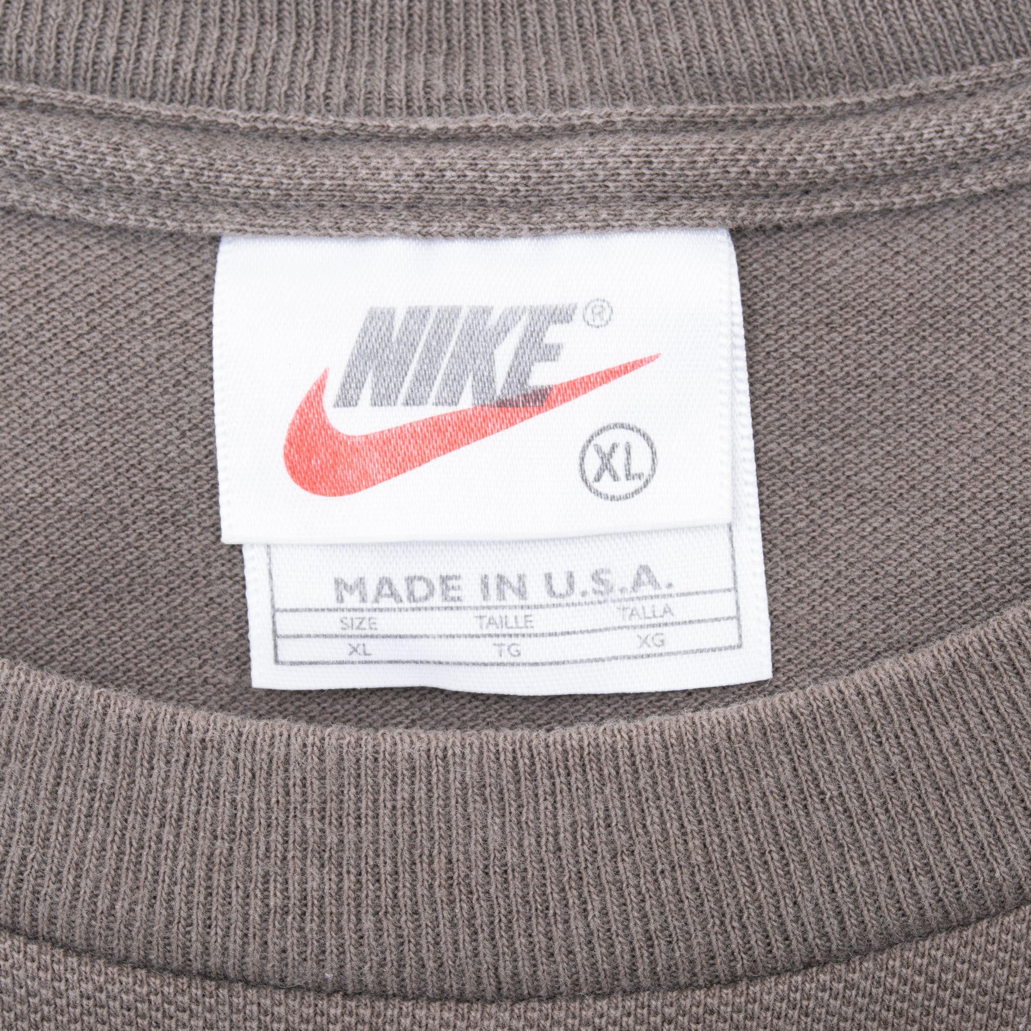Nike neck tag marked XL and Made in U.S.A. inside brown ribbed crew neckline