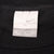 Close-up of Nike neck tag marked XL inside black T-shirt