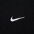 Close-up of white embroidered Nike Swoosh on black fabric