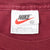 Nike neck tag marked XL and Made in U.S.A. inside burgundy T-shirt
