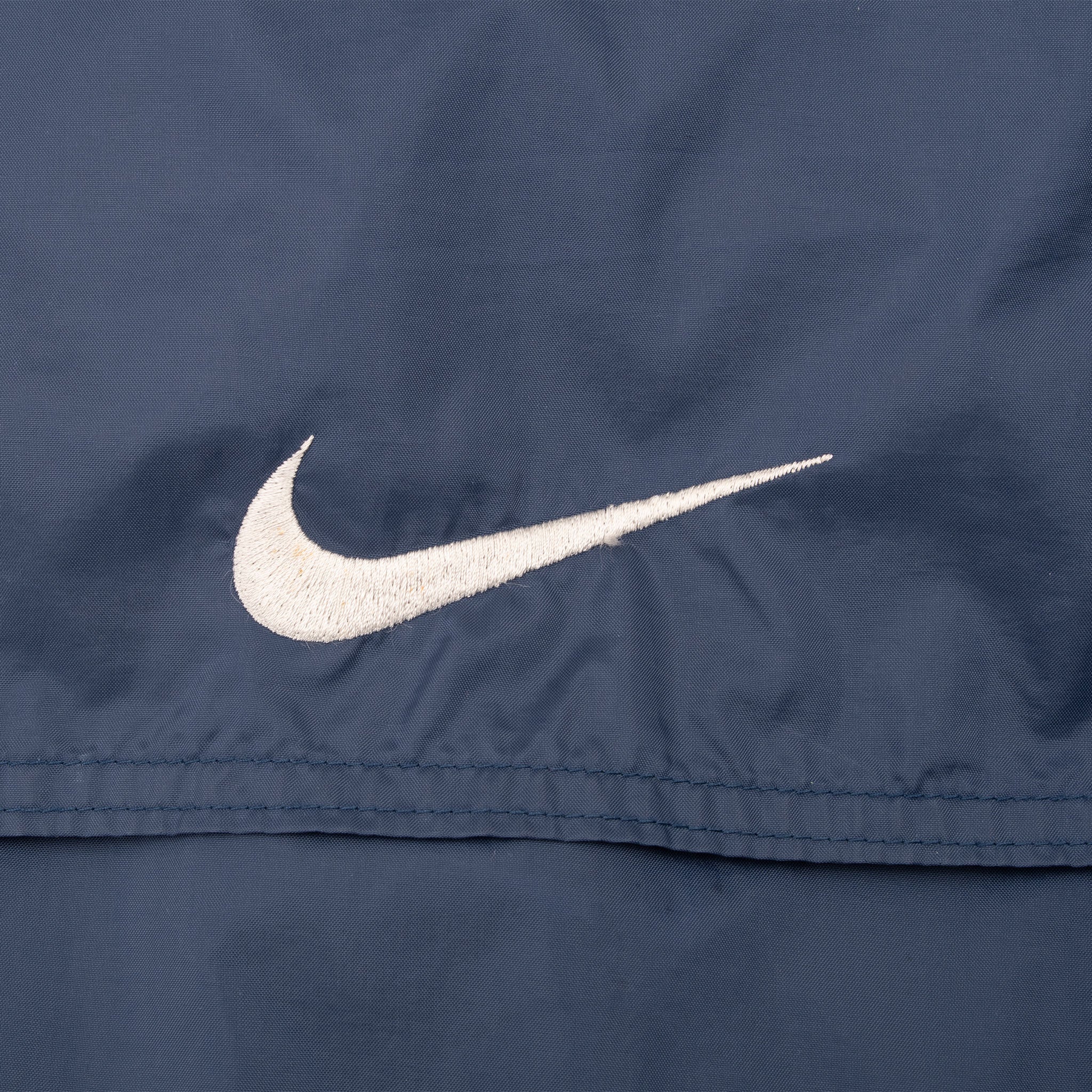 VINTAGE NIKE CLASSIC SWOOSH NAVY BLUE WINDBREAKER JACKET 1990S XL
