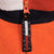 Close-up of Tommy Hilfiger branded zipper pull and striped fleece collar