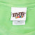 M&M's World neck tag and 2XL size label on green T-shirt
