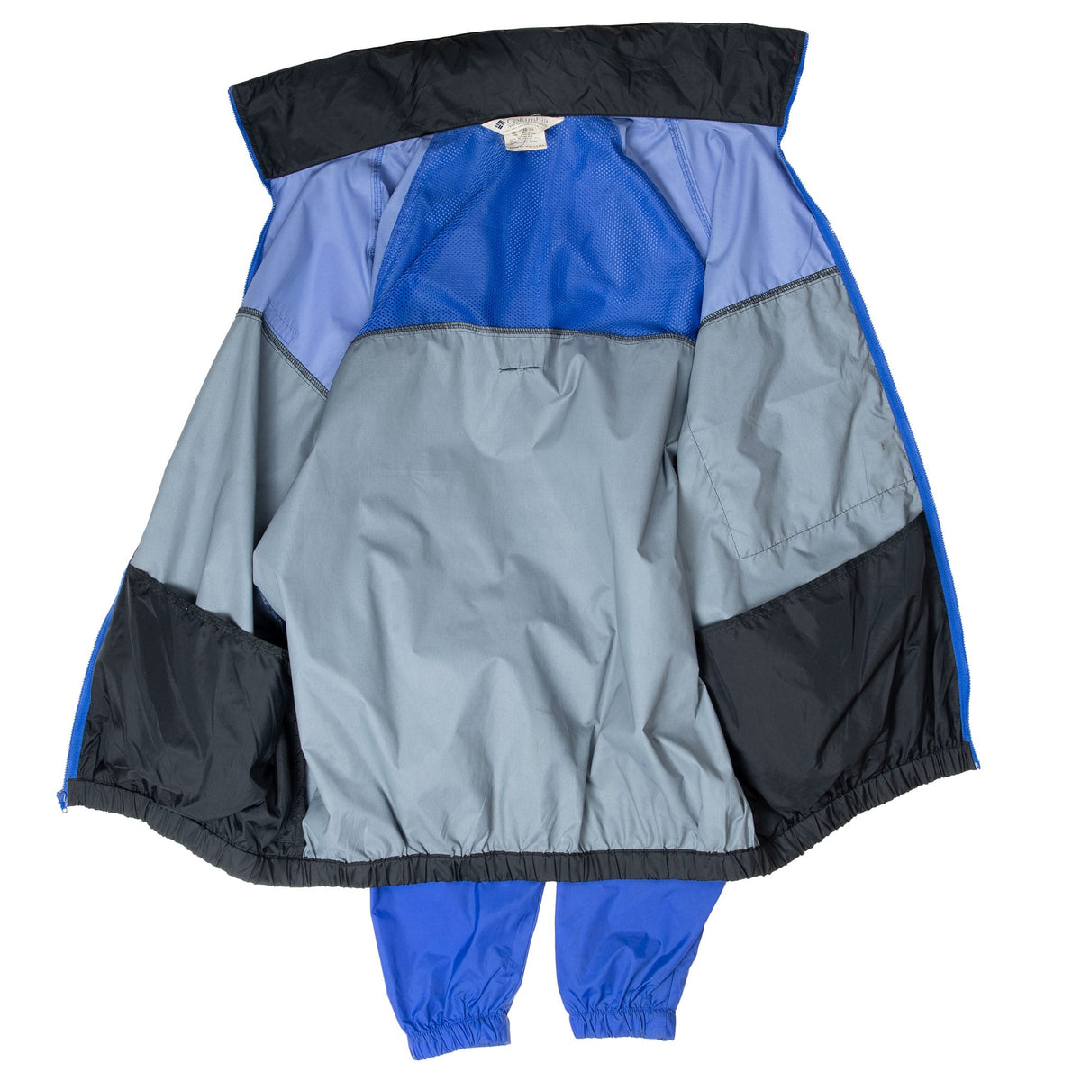 Open Columbia windbreaker showing blue mesh paneling and gray interior lining