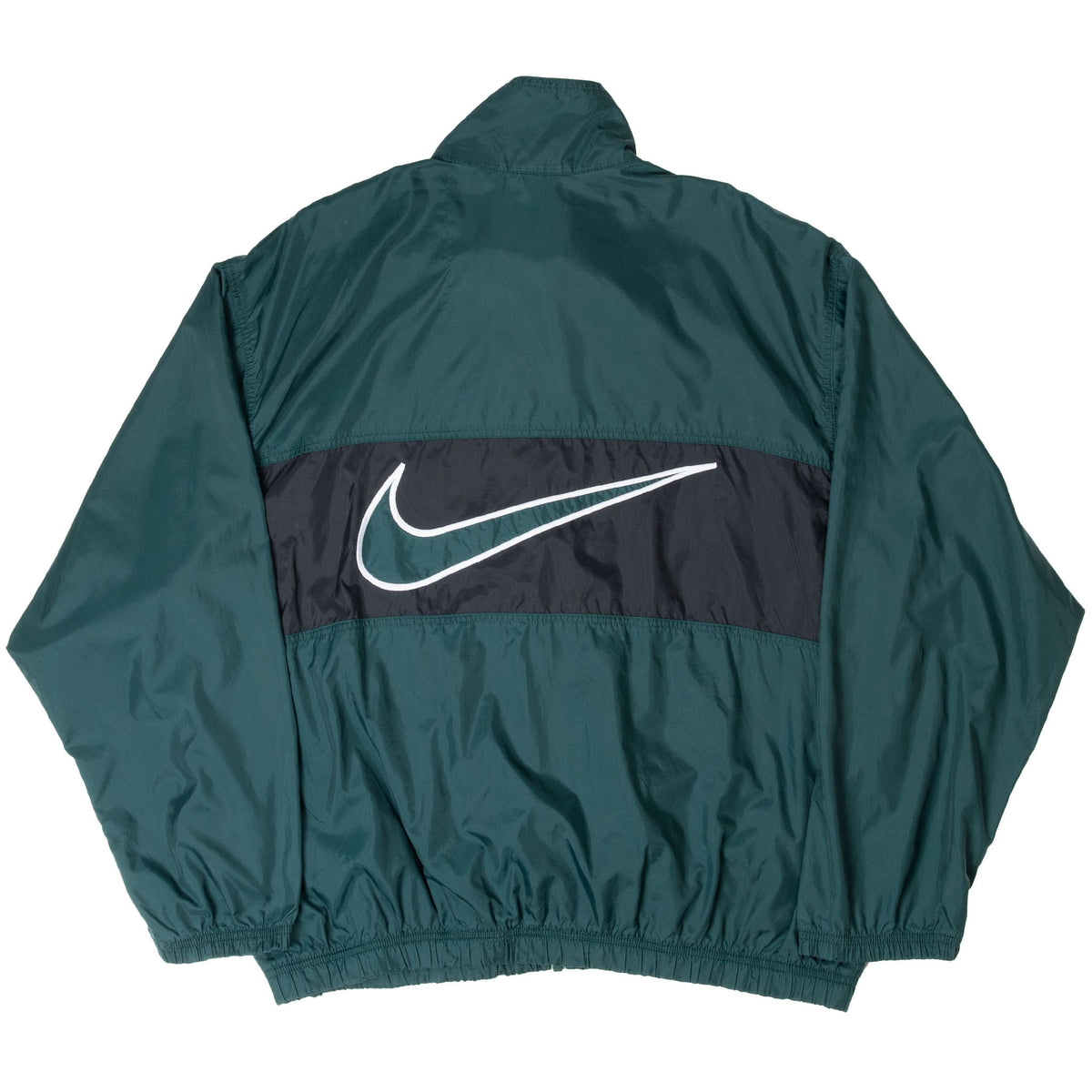 Back of green Nike windbreaker with oversized outlined Swoosh on black panel
