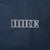 Close-up of outlined Nike embroidery on back of navy windbreaker