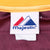Majestic brand neck tag inside the maroon and gold jersey collar