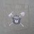 Close-up of Smokey Bear chest pocket print with crossed axe and shovel