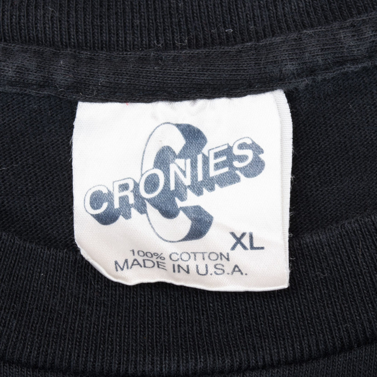 Close-up of Cronies XL neck label marked 100% cotton and made in USA