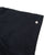 Close-up of black sleeve with a small spot indicated by an arrow marker