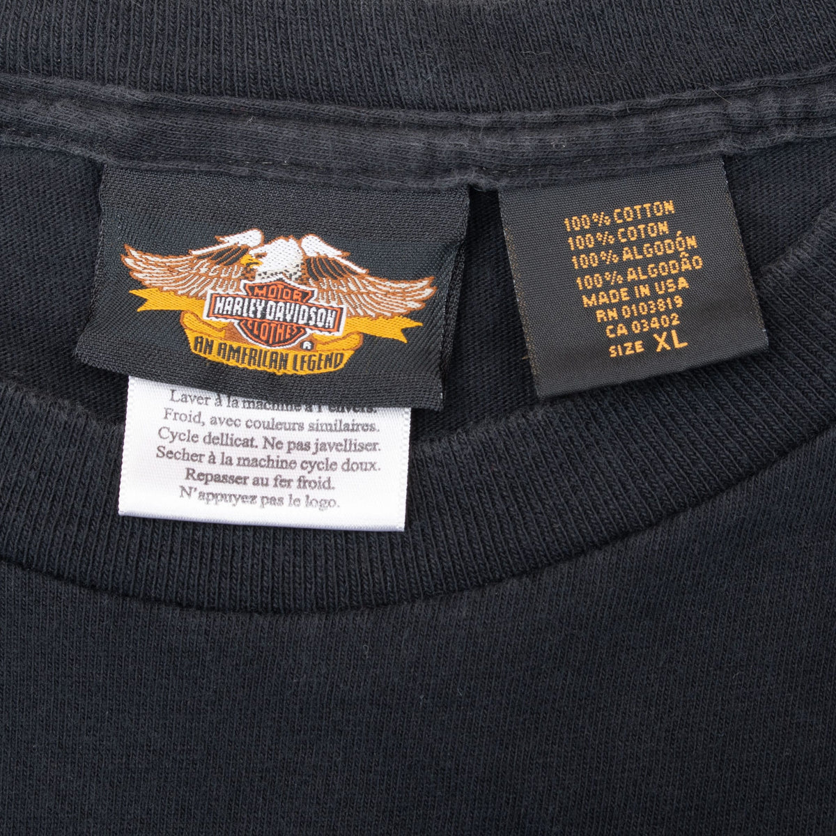 Harley-Davidson eagle neck label and size XL fabric tag inside black T-shirt