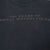 Close-up of tonal back print reading 100 Years of Great Motorcycles