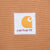 Close-up of square Carhartt logo patch stitched inside brown hunter vest