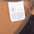 Carhartt VU256 care label with union-made USA text inside brown hunter vest