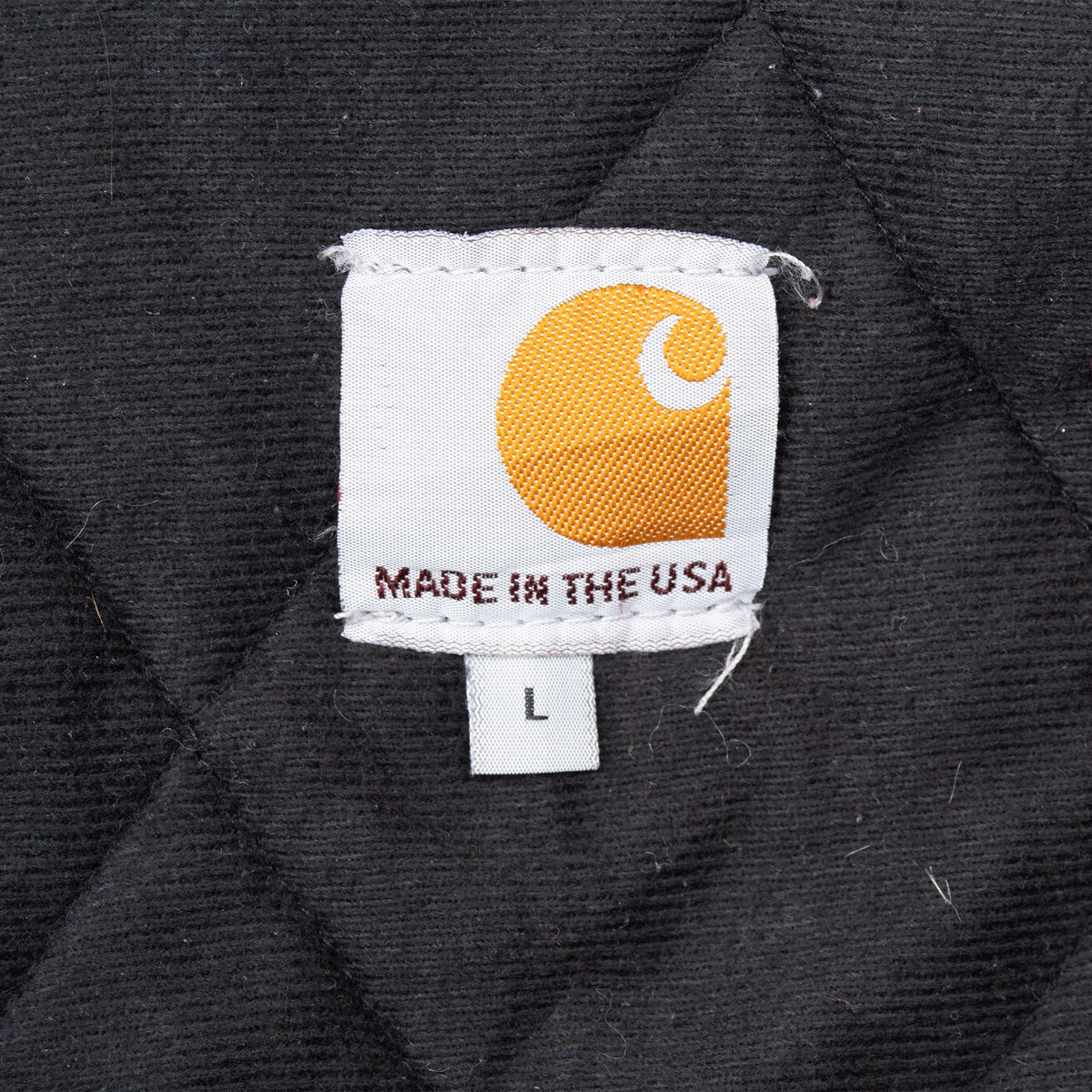 Carhartt Made in USA neck label with size L tag