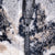 Close-up of black front zipper and wolf-print fleece texture