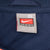 Close-up of Nike Team XL neck tag inside navy Illinois windbreaker