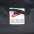 Nike neck label on black windbreaker marked size large and made in Thailand