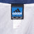 Adidas Team size small neck label against the jacket's white mesh lining