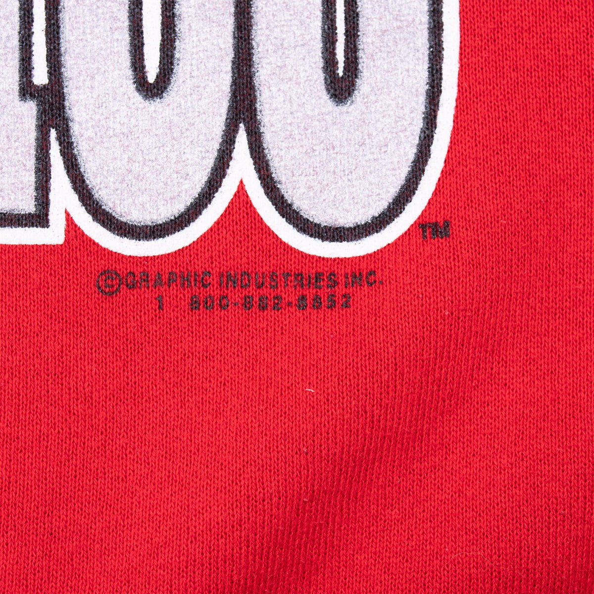 Close-up of Graphic Industries copyright text below the front print