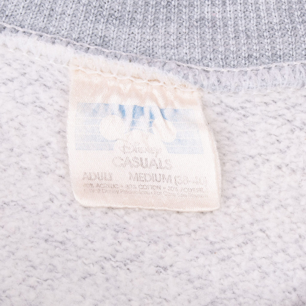 Close-up of faded interior Disney sweatshirt neck tag
