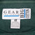 Gear for Sports Big Cotton neck label and XL fabric care tag inside the green sweatshirt