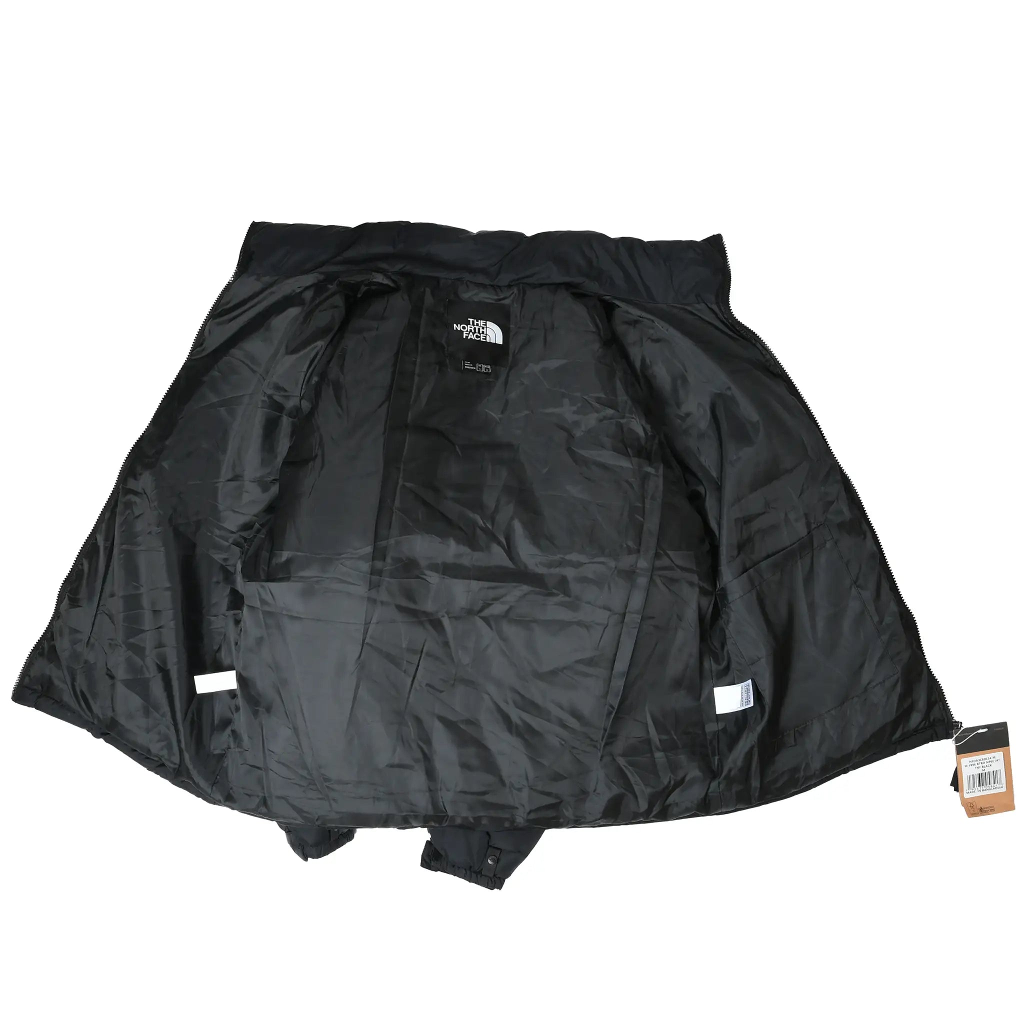 Open black The North Face Nuptse jacket showing interior lining, pockets, and label