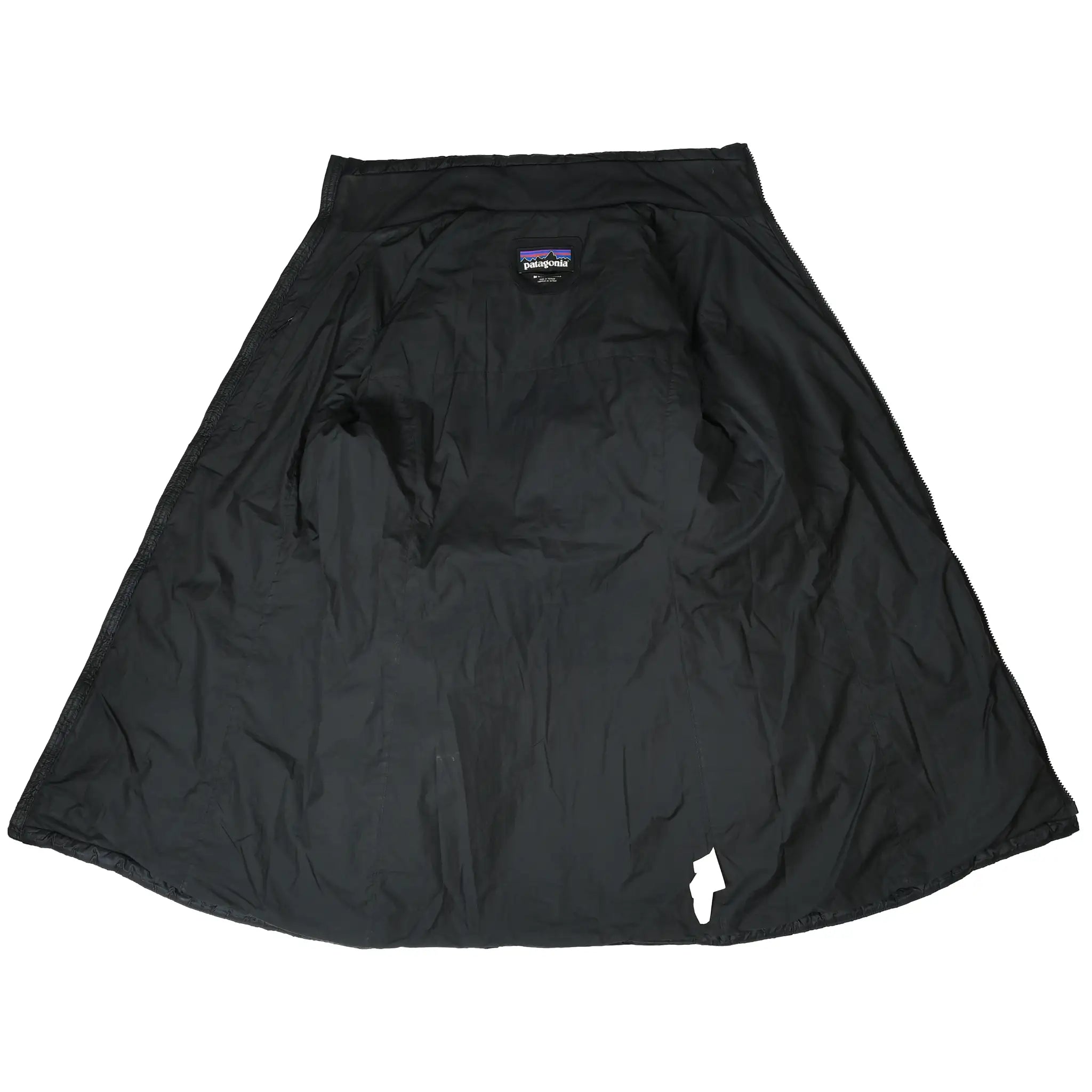 Open interior of black Patagonia Radalie parka showing lining and neck label