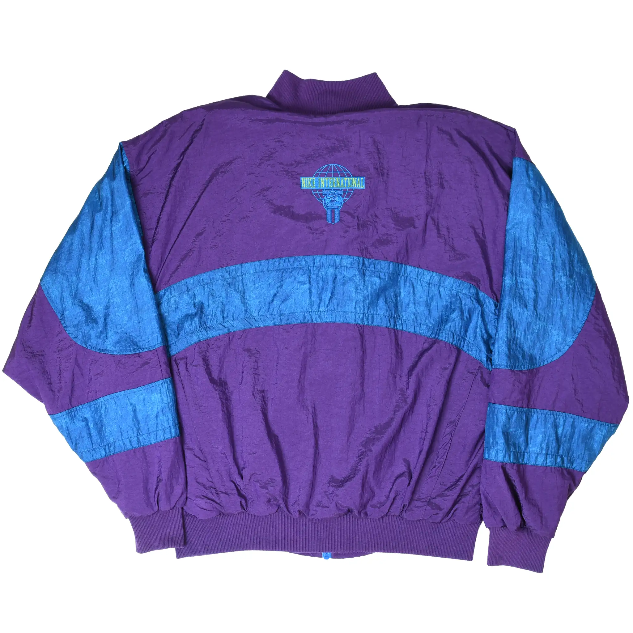 Back of purple and blue Nike International windbreaker with embroidered globe logo
