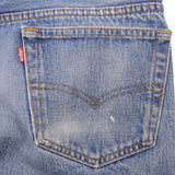 Beautiful Indigo Levis 501 jeans Made in USA with Light Wash.  Size on tag 35X23 Actual Size 33X28 Back Button #501