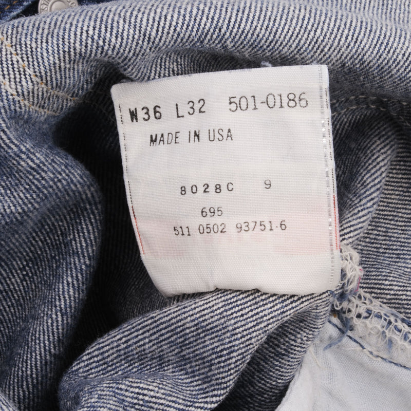 Beautiful Indigo Levis 501 jeans 1990s Made in USA with Medium Dark Wash.  Size on tag 36X32 Actual Size 35X31 Back Button #511
