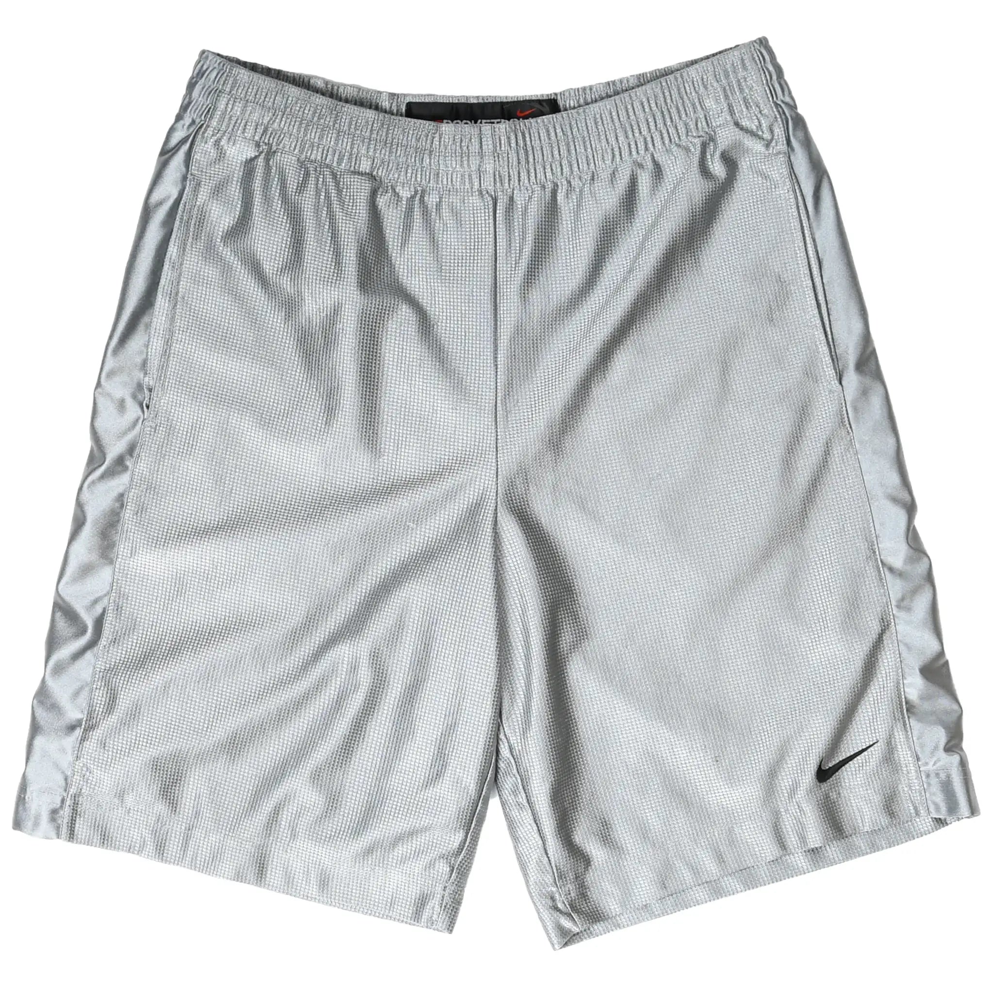 Front of silver Nike basketball shorts with black Swoosh embroidery