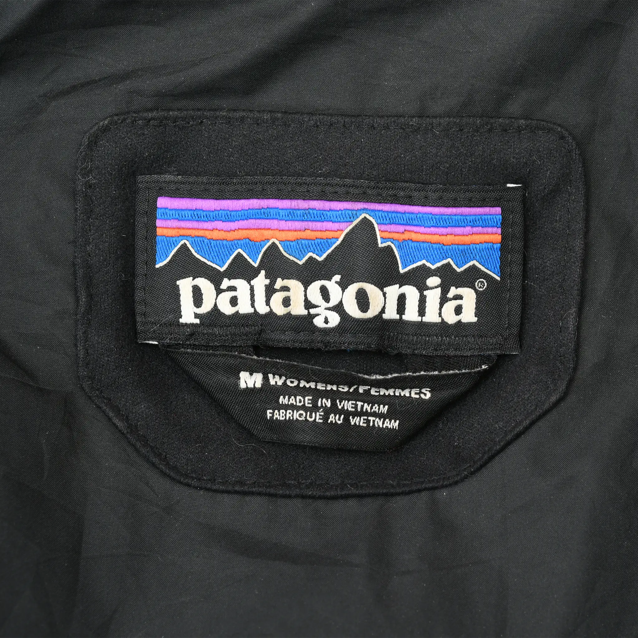 Patagonia neck label with women's medium size marking