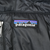Patagonia logo label inside black Radalie parka