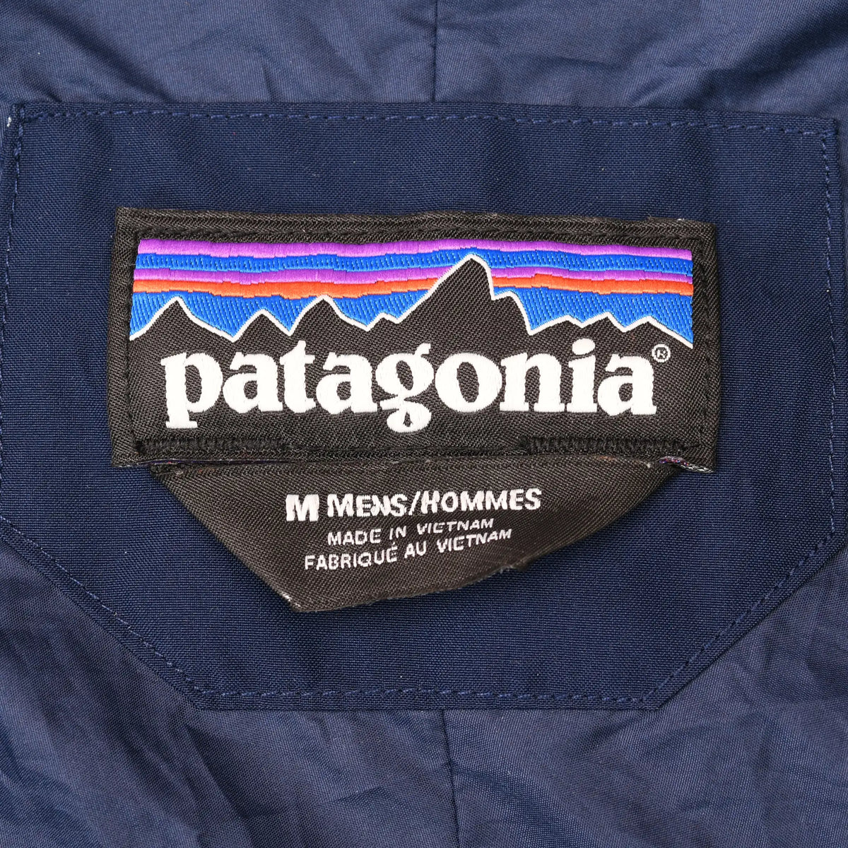 Patagonia interior neck label marked men's medium and made in Vietnam