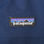 Patagonia logo patch on navy blue jacket chest