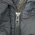 Close-up of gray Patagonia parka YKK front zipper