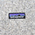 Close-up of Patagonia logo patch on beige heather fleece
