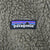 Patagonia woven logo patch on olive fleece