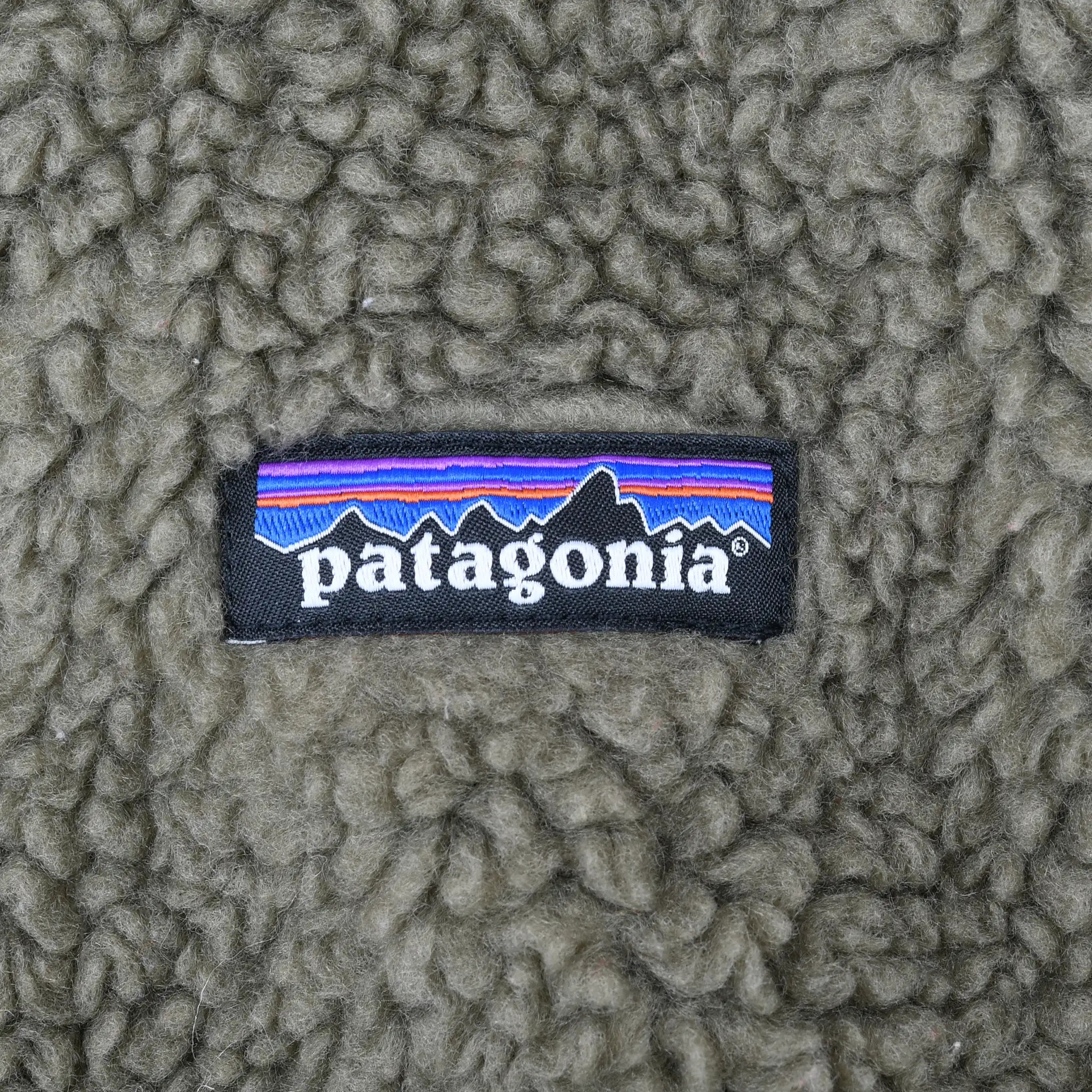 Patagonia woven logo patch on olive fleece