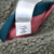 Interior style tag marked STY68320FA21 among olive fleece, teal trim, and pink lining
