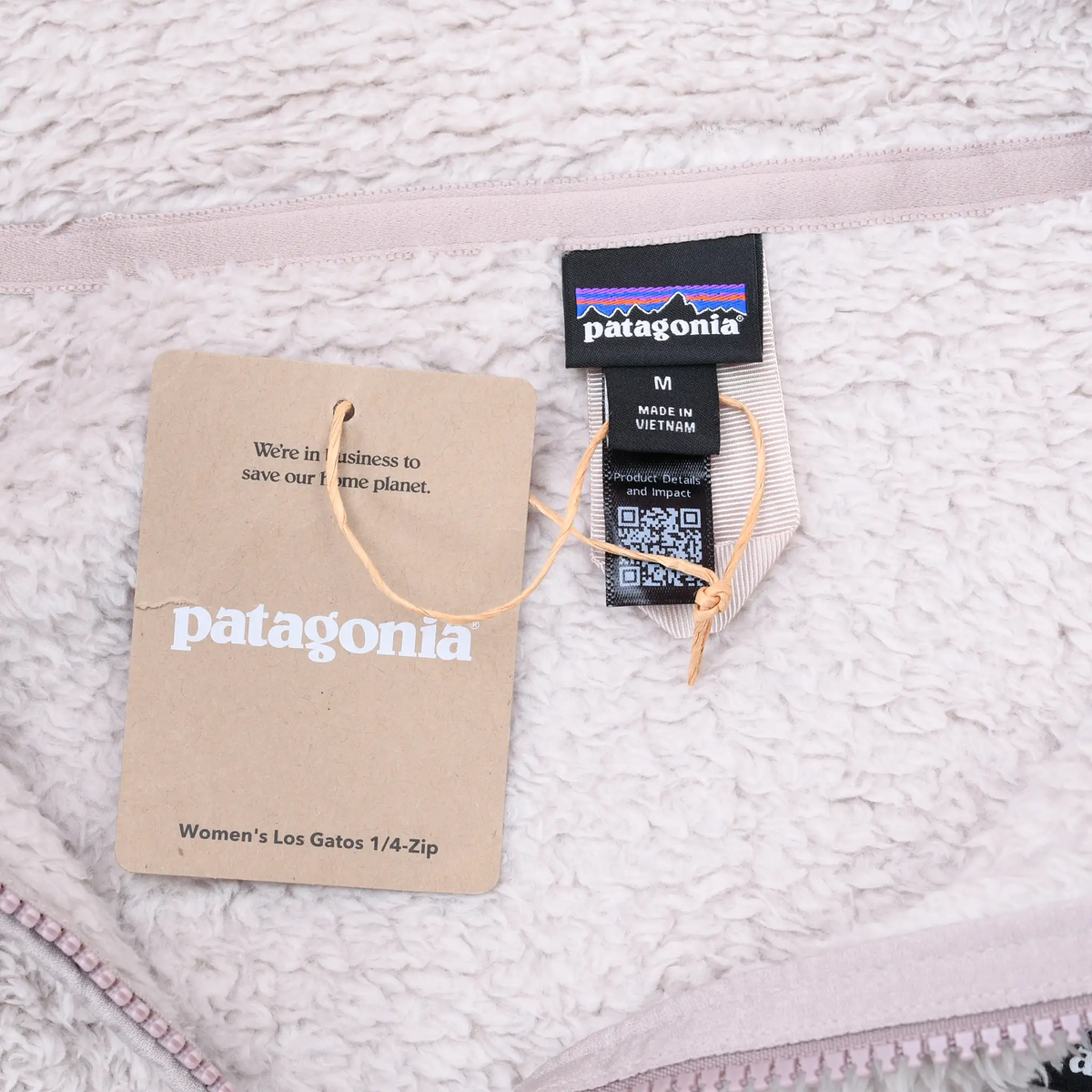 Patagonia neck label, medium size tag, and Women's Los Gatos quarter-zip hang tag
