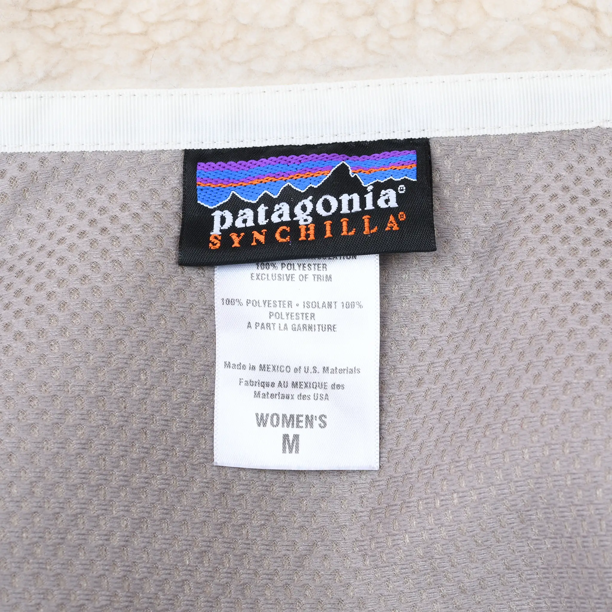 Patagonia Synchilla neck label and women's medium size tag inside jacket