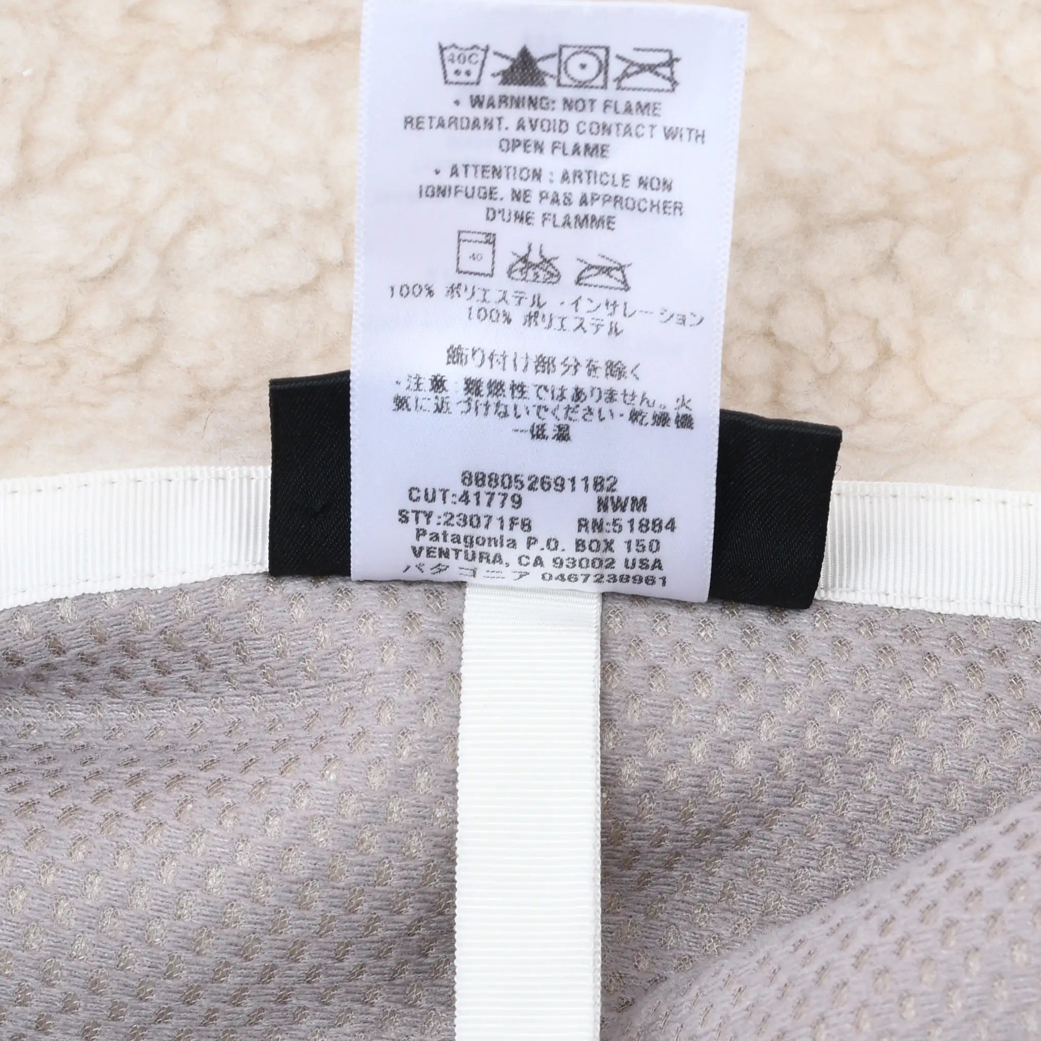 Patagonia jacket care tag with style and production details