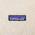 Patagonia logo patch embroidered on beige fleece