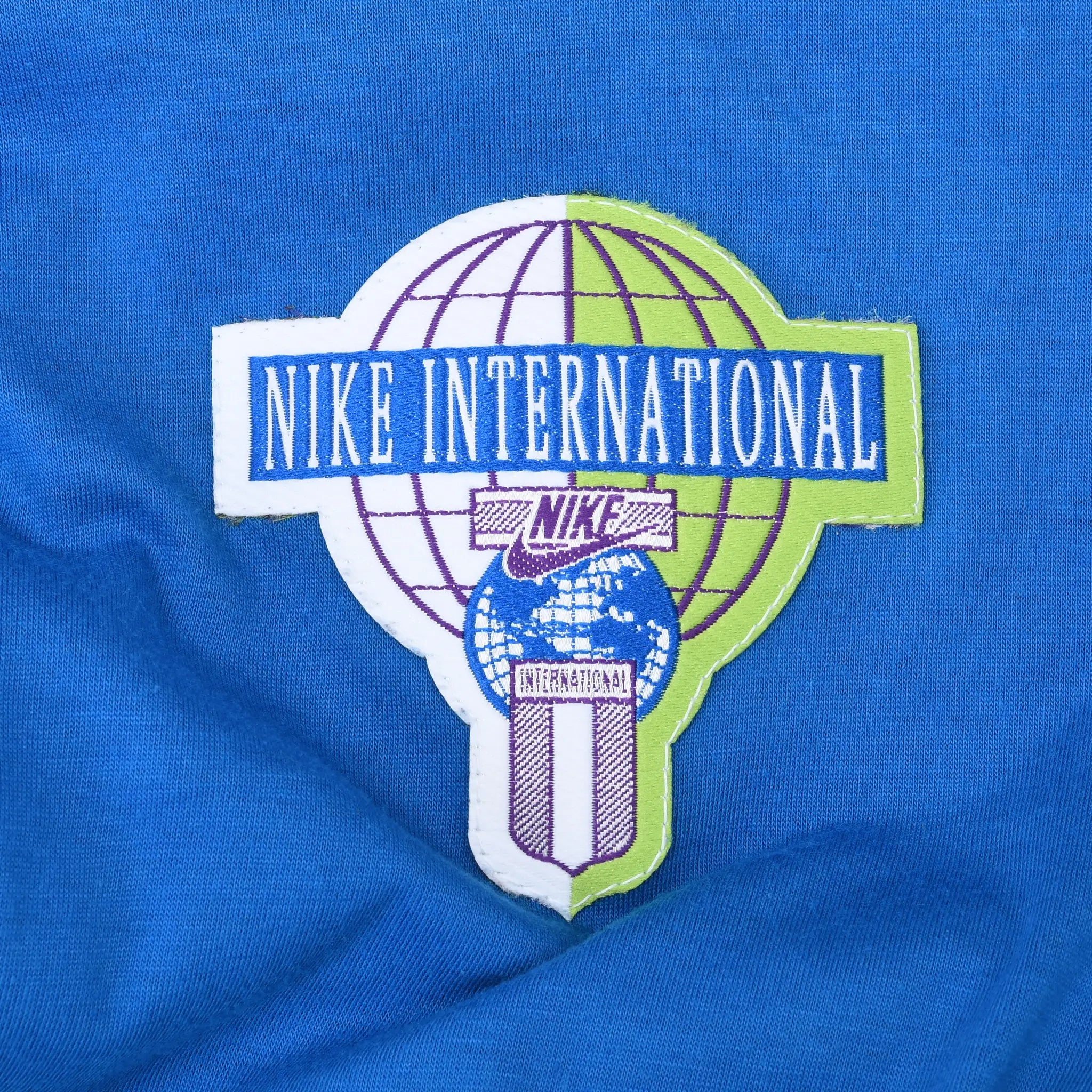 Interior Nike International globe logo patch on blue lining