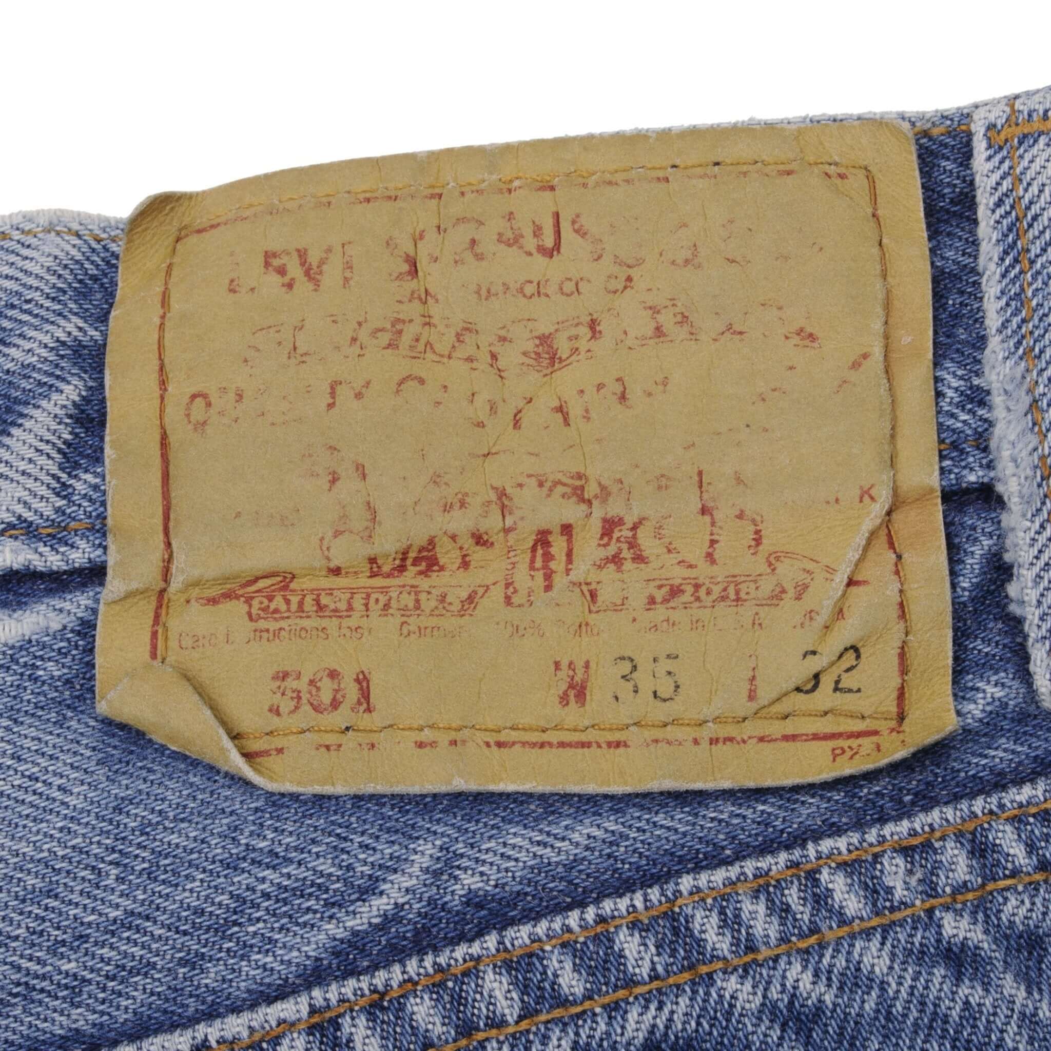 Beautiful Indigo Levis 501 Jeans 1980s Made in USA with Medium Light Wash.  Size on tag 35X32 Actual Size 34X31 Back Button #653