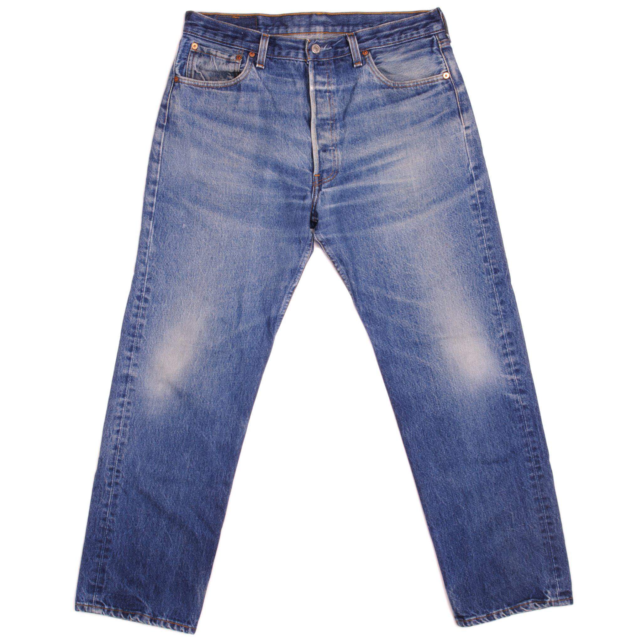 Beautiful Indigo Levis 501 Jeans 1990's Made in USA with a medium blue wash, a nice contrast between light and medium blue and some strong whiskers.  Size 35x29  Back Button #524M