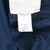 Interior Nike care tag with product codes and XL marking